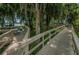 Picturesque boardwalk with seating, offering scenic views of the surrounding nature and waterfront at 4693 Aylesford Dr, Palm Harbor, FL 34685