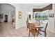 Charming breakfast nook with views of the pool and adjacent living spaces at 4693 Aylesford Dr, Palm Harbor, FL 34685