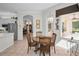 Open breakfast nook with natural light, providing a seamless flow to the outdoors at 4693 Aylesford Dr, Palm Harbor, FL 34685