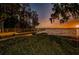 A beautiful sunset view of the waterfront pier, perfect for relaxing evening strolls at 4693 Aylesford Dr, Palm Harbor, FL 34685