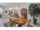 Elegant dining room showcasing a chandelier, classic decor, and a view into the living area at 4693 Aylesford Dr, Palm Harbor, FL 34685