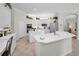Bright, open kitchen with stainless appliances, double islands, and white cabinetry at 4693 Aylesford Dr, Palm Harbor, FL 34685