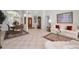 Spacious living room with a dining area, a seating area, tile floors, and a decorative rug at 4693 Aylesford Dr, Palm Harbor, FL 34685