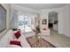 Living room featuring elegant drapes, furniture, decor, and sliding doors that lead to an outdoor pool at 4693 Aylesford Dr, Palm Harbor, FL 34685