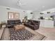 Inviting living room featuring comfortable seating, a decorative rug, and natural light at 4693 Aylesford Dr, Palm Harbor, FL 34685