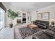 Comfortable living room with a fireplace, stylish decor, and ample seating at 4693 Aylesford Dr, Palm Harbor, FL 34685