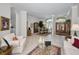 Spacious living room with tile floors, furniture and decor including a table, lamps, and area rugs at 4693 Aylesford Dr, Palm Harbor, FL 34685