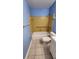 Cozy bathroom with a white tub, yellow tile surround, and tiled floors at 4801 Airport Rd # 118, Zephyrhills, FL 33542