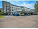 Beautiful multi-story condo complex featuring convenient covered parking and well-maintained grounds at 4801 Airport Rd # 118, Zephyrhills, FL 33542