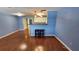 Inviting living space with hardwood floors and seamless access to the open kitchen area at 4801 Airport Rd # 118, Zephyrhills, FL 33542