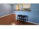 Inviting living space with hardwood floors and seamless access to the open kitchen area at 4801 Airport Rd # 118, Zephyrhills, FL 33542