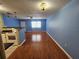 Open floor plan featuring the kitchen, living area, and attractive flooring throughout at 4801 Airport Rd # 118, Zephyrhills, FL 33542