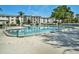 Inviting community pool area with lush greenery at 4801 Airport Rd # 118, Zephyrhills, FL 33542