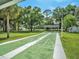 Recreational shuffleboard courts with lush green lawns and shaded areas at 4801 Airport Rd # 118, Zephyrhills, FL 33542