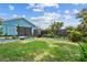 Fenced back yard with lawn and planter beds at 500 45Th S St, St Petersburg, FL 33711