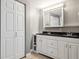 Bathroom features double sinks, vanity with drawers, and large mirror over sink at 500 45Th S St, St Petersburg, FL 33711