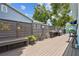 Charming wood deck area with decorative fence, seating, and greenery at 500 45Th S St, St Petersburg, FL 33711