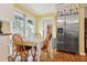 Charming dining area with natural light, stainless steel refrigerator, and convenient access to the kitchen at 500 45Th S St, St Petersburg, FL 33711