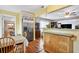 Charming dining area with natural light, stainless steel refrigerator, and convenient access to the kitchen at 500 45Th S St, St Petersburg, FL 33711