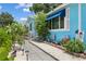 Charming home with a landscaped front yard, featuring a walkway, flower beds, and shrubs at 500 45Th S St, St Petersburg, FL 33711