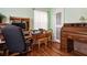 Office features desk with printer, rolltop desk, wood floors, and a window for natural light at 500 45Th S St, St Petersburg, FL 33711