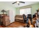 Office features wood floors, a sofa, a ceiling fan, and a window for natural light at 500 45Th S St, St Petersburg, FL 33711