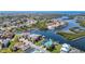 Panoramic aerial view of a coastal neighborhood with waterfront homes, serene canals, and lush landscaping at 5623 Jobeth Dr, New Port Richey, FL 34652