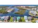 Stunning aerial view of waterfront homes showcasing vibrant architecture and serene canal access at 5623 Jobeth Dr, New Port Richey, FL 34652
