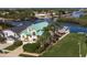 Impressive aerial of a waterfront home with lush landscaping, dock, and boatlift at 5623 Jobeth Dr, New Port Richey, FL 34652
