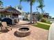 Spacious backyard with a tiki bar, fire pit, and water views, ideal for entertaining at 5623 Jobeth Dr, New Port Richey, FL 34652