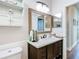 Bathroom boasts a framed mirror, modern vanity, and elegant fixtures at 5623 Jobeth Dr, New Port Richey, FL 34652