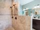 Elegant bathroom with a tiled shower and a partial wall, providing privacy at 5623 Jobeth Dr, New Port Richey, FL 34652