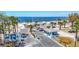 A view shows the park entrance, guard house and beach, with palm trees and picnic shelters at 5623 Jobeth Dr, New Port Richey, FL 34652