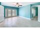 Bedroom with tiled floors, ceiling fan, and french doors at 5623 Jobeth Dr, New Port Richey, FL 34652