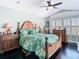 Comfortable bedroom featuring dark wood floors and a beautiful window view at 5623 Jobeth Dr, New Port Richey, FL 34652