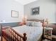 Cozy bedroom features a comfortable bed, coastal decor, and a calming color scheme for a relaxing atmosphere at 5623 Jobeth Dr, New Port Richey, FL 34652