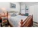 Charming bedroom features a comfortable bed, coastal decor, and plantation shutters at 5623 Jobeth Dr, New Port Richey, FL 34652