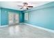 Bedroom with tiled floors, ceiling fan, and french doors at 5623 Jobeth Dr, New Port Richey, FL 34652