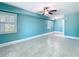 Bedroom with tiled floors, ceiling fan, and windows at 5623 Jobeth Dr, New Port Richey, FL 34652