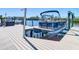 Boat in a lift on a private boat dock, perfect for boating enthusiasts at 5623 Jobeth Dr, New Port Richey, FL 34652