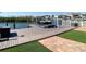 Private boat dock with a boat lift and a view of the water, complementing the home's outdoor amenities at 5623 Jobeth Dr, New Port Richey, FL 34652