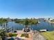 Picturesque view of a private boat dock offering direct access to the calm, scenic waterway at 5623 Jobeth Dr, New Port Richey, FL 34652