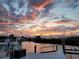 Sunset on the dock with peaceful water views and beautiful sky at 5623 Jobeth Dr, New Port Richey, FL 34652