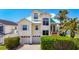 Lovely two-story home with a turquoise roof, double garage, mature landscaping, and a welcoming entrance at 5623 Jobeth Dr, New Port Richey, FL 34652