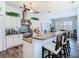 Open kitchen featuring granite counters, stainless appliances, and eat-in bar with counter seating at 5623 Jobeth Dr, New Port Richey, FL 34652
