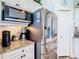 Close-up of kitchen featuring a stainless steel refrigerator and built-in microwave at 5623 Jobeth Dr, New Port Richey, FL 34652