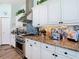 Close-up shot of the kitchen featuring stainless steel oven and granite countertops at 5623 Jobeth Dr, New Port Richey, FL 34652
