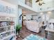 Open living room with tall ceilings, coastal decor, and views to the kitchen at 5623 Jobeth Dr, New Port Richey, FL 34652