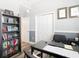 Inviting office featuring neutral paint, modern lighting, and a well-organized bookcase at 5623 Jobeth Dr, New Port Richey, FL 34652