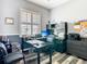 Functional home office with large desks, built-in shelving and storage for an organized and productive workspace at 5623 Jobeth Dr, New Port Richey, FL 34652